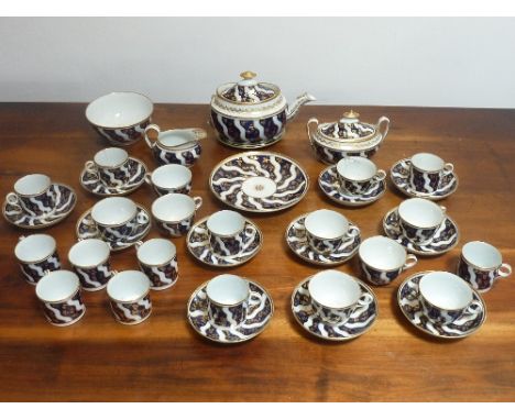 A late-18th / early-19th century New Hall Pottery part Tea/Coffee Service, comprising Teacups, Coffee Cans, Saucers, two-hand