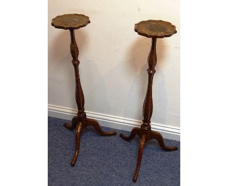 A pair of 18th/19th century Dutch walnut and floral marquetry inlaid Torchere Stands, each with flower head shaped top above 
