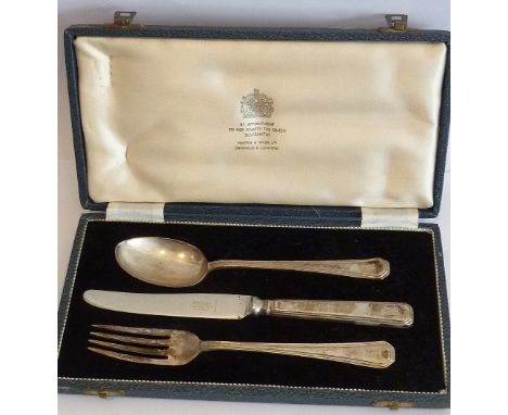 A boxed Mappin & Webb Knife, Fork and Spoon set having hallmarked silver handles