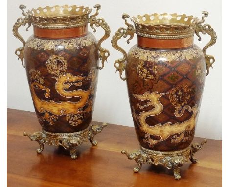An unusual pair of 19th century enamelled and brass mounted two-handled Vases, the handles modelled as Chilong dragons and fl