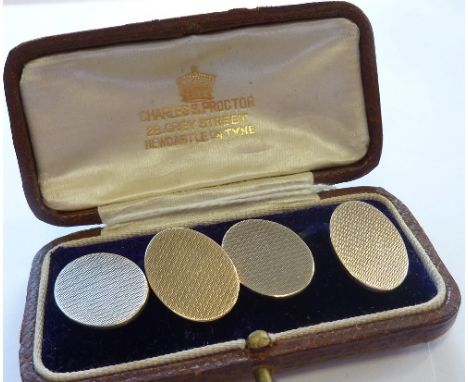 A pair of 9-carat gold oval engine-turned Cuff Links, (11.75g)