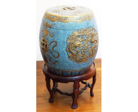 A small Chinese stoneware barrel-shaped Garden Seat with pierced Shou characters and auspicious objects, a Ruyi band to the t