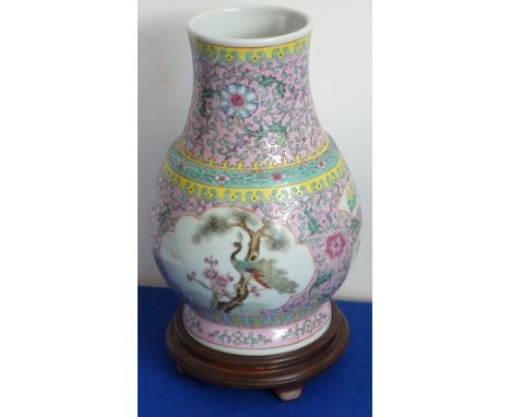 A Chinese Hu shaped porcelain Vase (modern), the two panels decorated with a Peacock and one other open-winged bird perched u