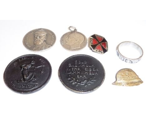 An interesting small collection of German First World War period  Medallions, Badges and a white metal Ring, the outside with