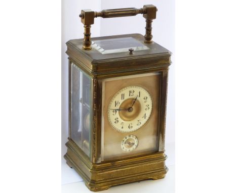 A large 19th Century gilt brass cased (rubbed) repeater Carriage Clock with alarm mechanism, the cream chapter ring with Arab