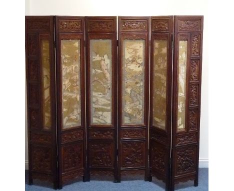 A very fine early-20th century Chinese hardwood (with material panels) six-fold Room Screen, the panels extremely finely deta