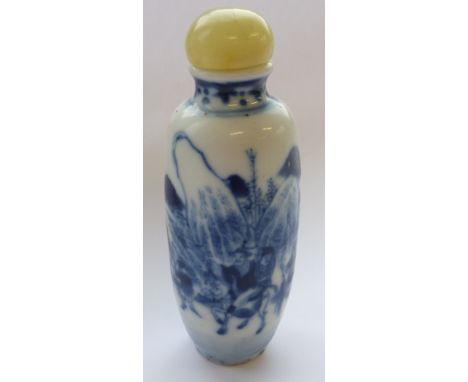 A large 19th century Chinese porcelain Snuff Bottle, hand-decorated in underglaze blue with mounted figures riding towards a 