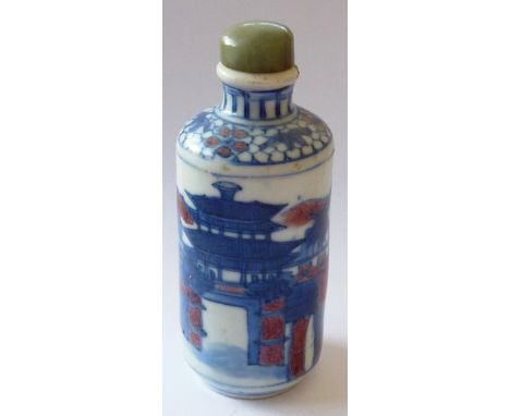 A large 19th century Chinese porcelain Snuff Bottle hand-decorated with cobalt blue and browns depicting a large building wit