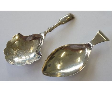 A hallmarked silver Caddy Spoon, the shaped bowl engraved with flowers and leaves etc.,  the handle engraved with an armorial