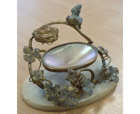 A 19th century gilt metal mounted Trinket Dish modelled as an open-winged bird above a nest and the bowl made from mother of 