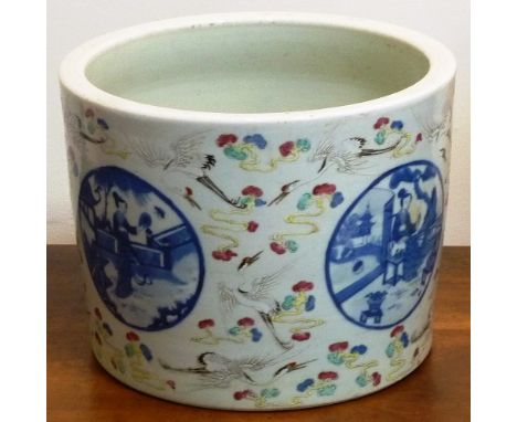 An early/mid-19th Century Chinese circular porcelain Planter finely decorated in relief enamels with cranes flying amongst st