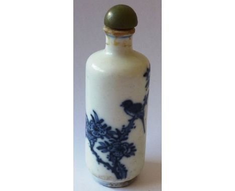 A 19th century Chinese porcelain Snuff Bottle of cylindrical form and decorated in dark cobalt blue with a single bird perche