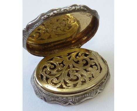 A mid-19th century oval silver Vinaigrette, engine-turned decoration and the lid with engraved initials and dated 1866, maker