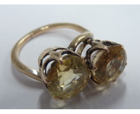 ADDED LOT    A ladies rose gold coloured Dress Ring set with two large hand cut light yellow stones, Ring size 'N'   CONDITIO