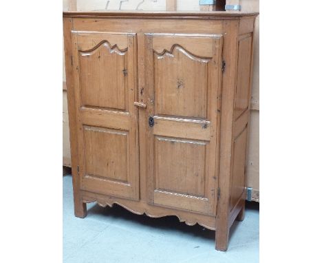 A good early-19th century French Canadian (possibly Quebec) pine Armoire/Side Cupboard of small proportions, the angular top 