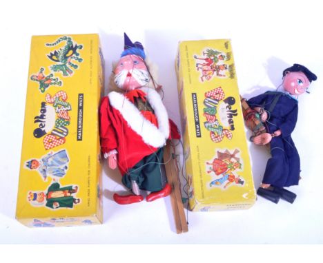 Two vintage 1960s Pelham Puppets Marlborough Wilts handmade and painted wooden puppets. The first puppet a sailor in navy blu