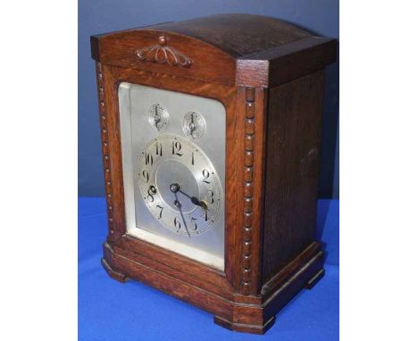 JUNGHANS OAK CHIMING MANTLE CLOCK
the silvered dial with subsidiary chime/silent and slow/fast dials, signed Junghans movemen