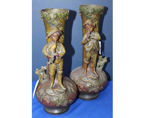 PAIR OF 20TH CENTURY FIGURATIVE SPELTER VASES
each modelled with a young boy playing a musical instrument within a naturalist