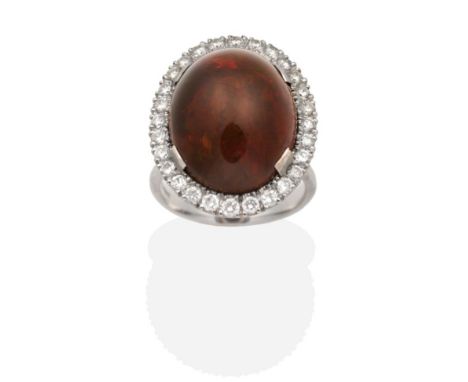 An 18 Carat White Gold Opal and Diamond Cluster Ring, an oval cabochon dark red opal in a claw setting, within a border of ro