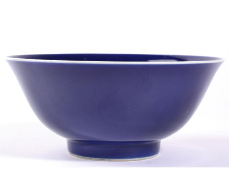 A Chinese Porcelain Blue Ground Bowl, with slightly everted rim, bears six character Qianlong seal mark, 18cm diameterSome mi