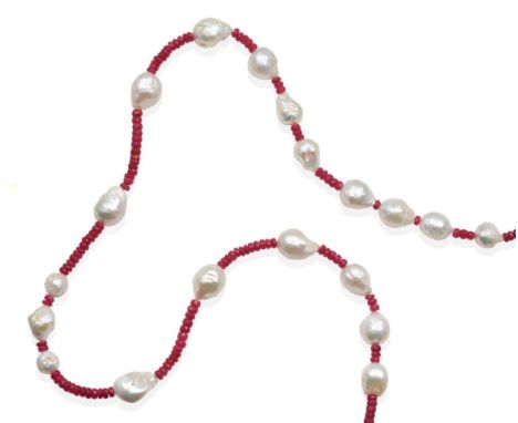 A Ruby and Cultured Pearl Necklace, faceted ruby beads spaced by cultured baroque pearls, length 68cm see illustration  .  Th