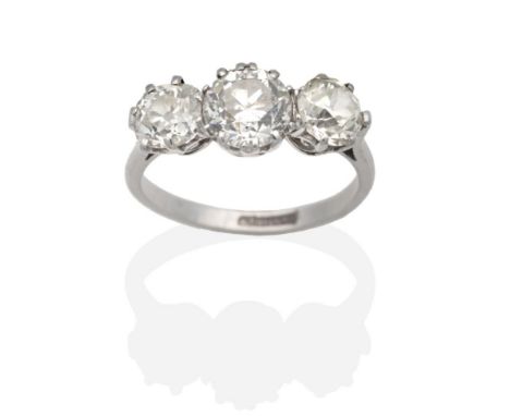 A Diamond Three Stone Ring, graduated old cut diamonds in claw settings, to tapering shoulders, total estimated diamond weigh