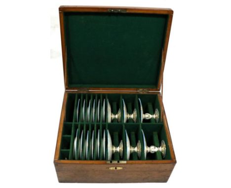 A Staffordshire Porcelain Dessert Service, circa 1860, with central gilt rosette within rose swags on gilt panels within Gree