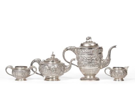 An Indian White Metal Three PIece Tea Service, late 19th century, spherical form, decorated with panels of deities and with e