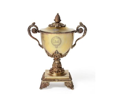 A French Silver-Gilt Twin Handled Cup and Cover, maker's mark indistinct, Paris 1st standard, 1819-1838, the bowl on acanthus