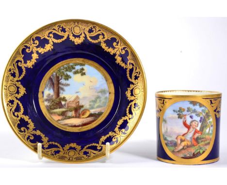 A Matched Sèvres Coffee Can and Saucer, date codes for 1776 and 1779, the can painted with a boy sitting under a fruiting bra