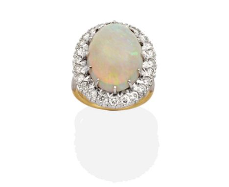 An Opal and Diamond Cluster Ring, an oval cabochon opal in a claw setting within a border of illusion set round brilliant cut