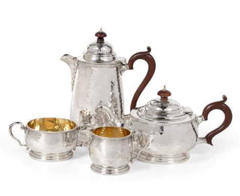 A Silver Four Piece Tea Service, William Greenwood & Son, Birmingham 1927-29, circular with planished finish and egg and dart