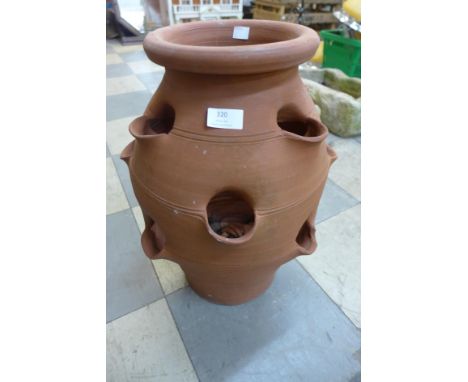 A terracotta strawberry planter 