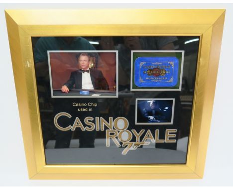 Casino Royale (2006) screen used prop $1,000,000 blue Casino Plaque (3" x 4.24") as used in the film with a photo of Daniel C