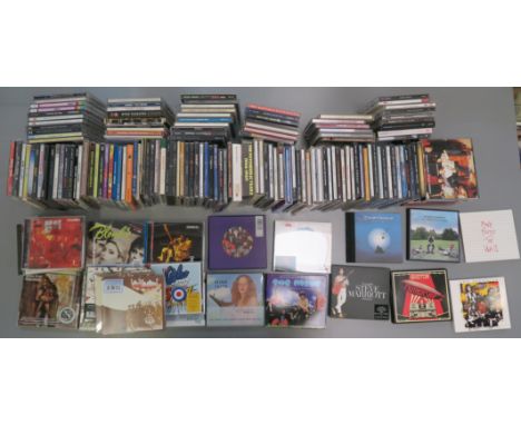 a collection of CDs including pink Floyd - the wall, Piper at the Gates of Dawn- mono , David Gilmour - on an island, led Zep