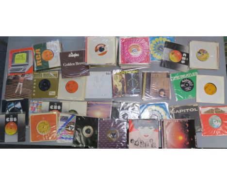 a large collection of 7 inch singles including John Lennon, George Harrison, the Beatles, Bob Dylan, Stevie wonder, David Bow