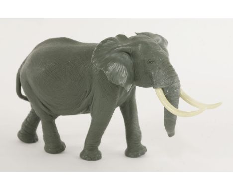A jasper elephant,carved by Gerd Dreher (b.1939) and retailed by Asprey, signed with monogram on the base of one foot, in a b