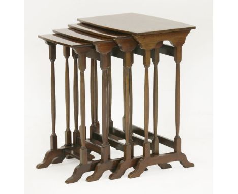 An Edwardian inlaid quartetto nest of tables,with a slight bow front and back over slender turned supports,49cm wide30cm deep