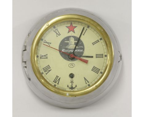 A Vostok Russian submarine clock,steel with brass bezel, with a brass key,21cm diameter overall