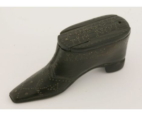 A commemorative treen snuff box,dated 1782, in the form of a shoe with studwork decoration reading 'Royal George sunk 1782', 
