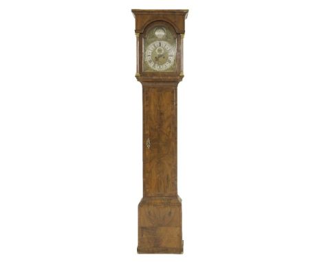 A walnut eight-day longcase clock,by Benjamin Huntsman, Doncaster, the arched brass dial with an engraved boss over a silvere
