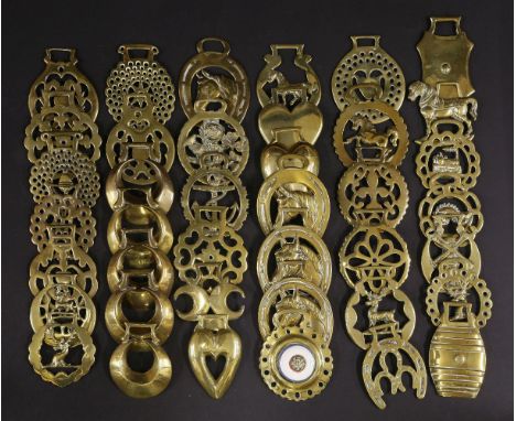 Forty horse brasses,including barrel, windmill, horses, hearts, stags, anchor, ceramic boss, train, horseshoes (40)