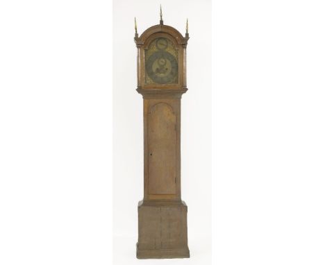 An oak longcase clock, 18th century, having a brass arched dial with strike and silent subsidiary dial, seconds dial and date