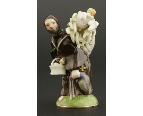 A Meissen porcelain double scent bottle,modelled as a monk carrying a girl in a sheaf on his back, a basket of eggs and a duc