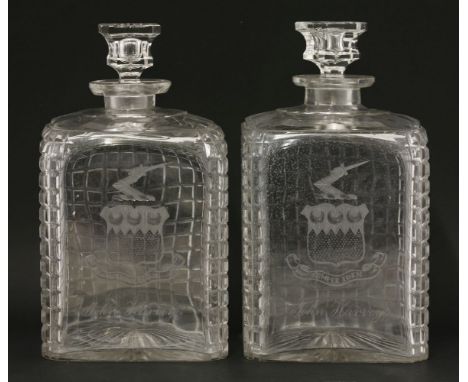 An extraordinary pair of large square decanters and stoppers,each with square cut decoration and engraved with the arms, cres