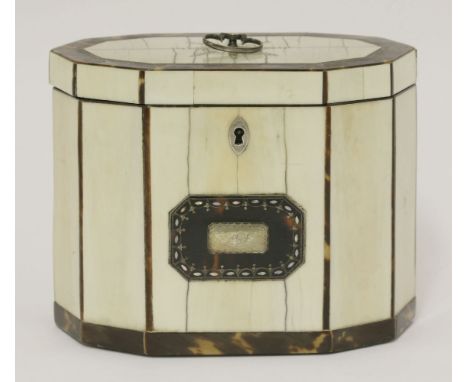 A George III ivory and tortoiseshell twin compartment tea caddy,ten-sided with a silver handle within mother-of-pearl piqué w