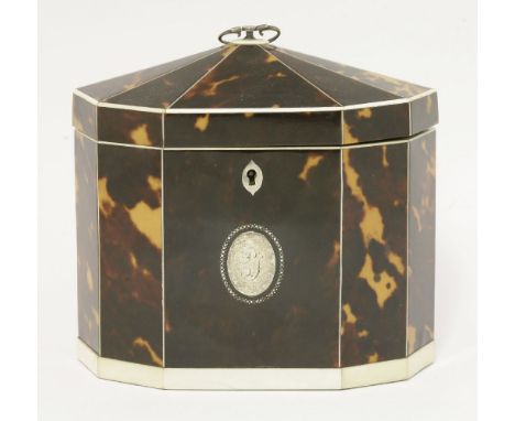 A George III tortoiseshell twin compartment tea caddy,having a domed ten-sided cover with ivory borders, the front with an in