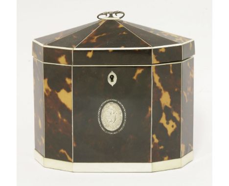 A George III tortoiseshell twin compartment tea caddy,having a domed ten-sided cover with ivory borders, the front with an in