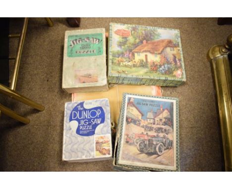 Quantity of vintage 20th Century jigsaw puzzles to include; GNR puzzle, Victory jigsaw puzzles, Dunlop jigsaw puzzle, etc  