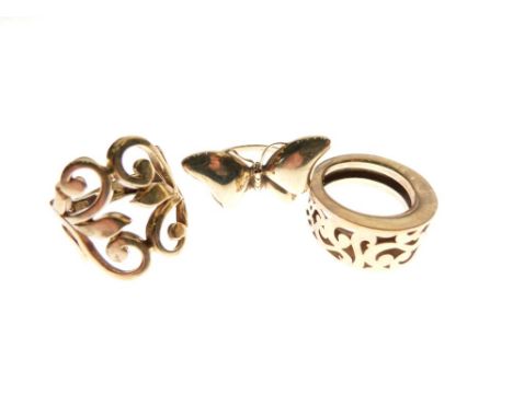 Two 9ct gold dress rings, one formed as a butterfly, size P, the other with foliate scroll work, size L½, together with an un